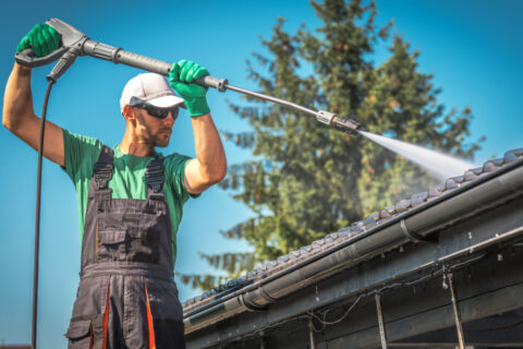 Man Cleaning Gutters